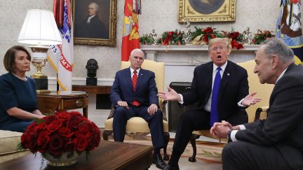 President Donald Trump argues about border security with Senator Chuck Schumer and Representative Nancy Pelosi as Vice President Mike Pence sits nearby in the Oval Office on December 11, 2018