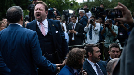 Playboy magazine contributor Brian Karem (L) and former Trump deputy assistant Sebastian Gorka (2ndL) argue after the US president delivered remarks on citizenship and the census at the White House in Washington, DC, on July 11, 2019.