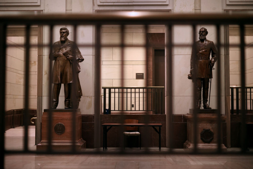 Statues of James Zachariah George (L), a colonel in the Confederate Army and U.S. Senator from Mississippi, and Edmund Kirby Smith, a native Floridian and a Confederal general, stand inside the U.S. Capitol Visitors Center.