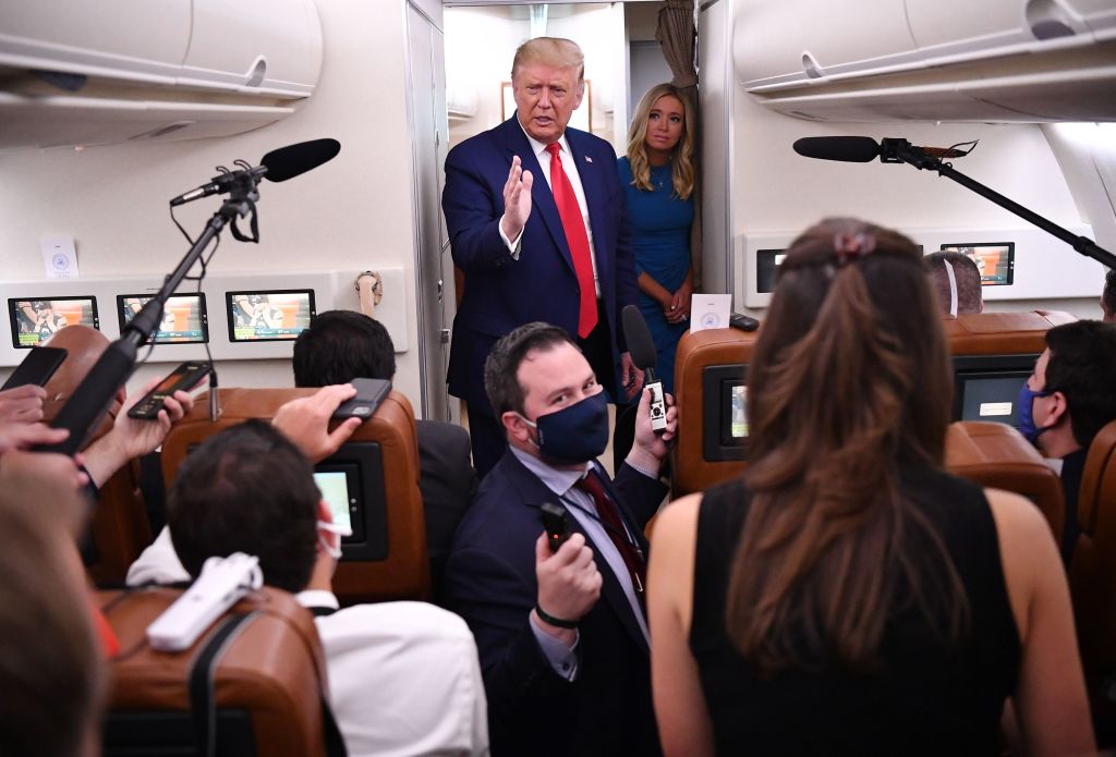 A maskless President Donald Trump addresses reporters on Air Force One