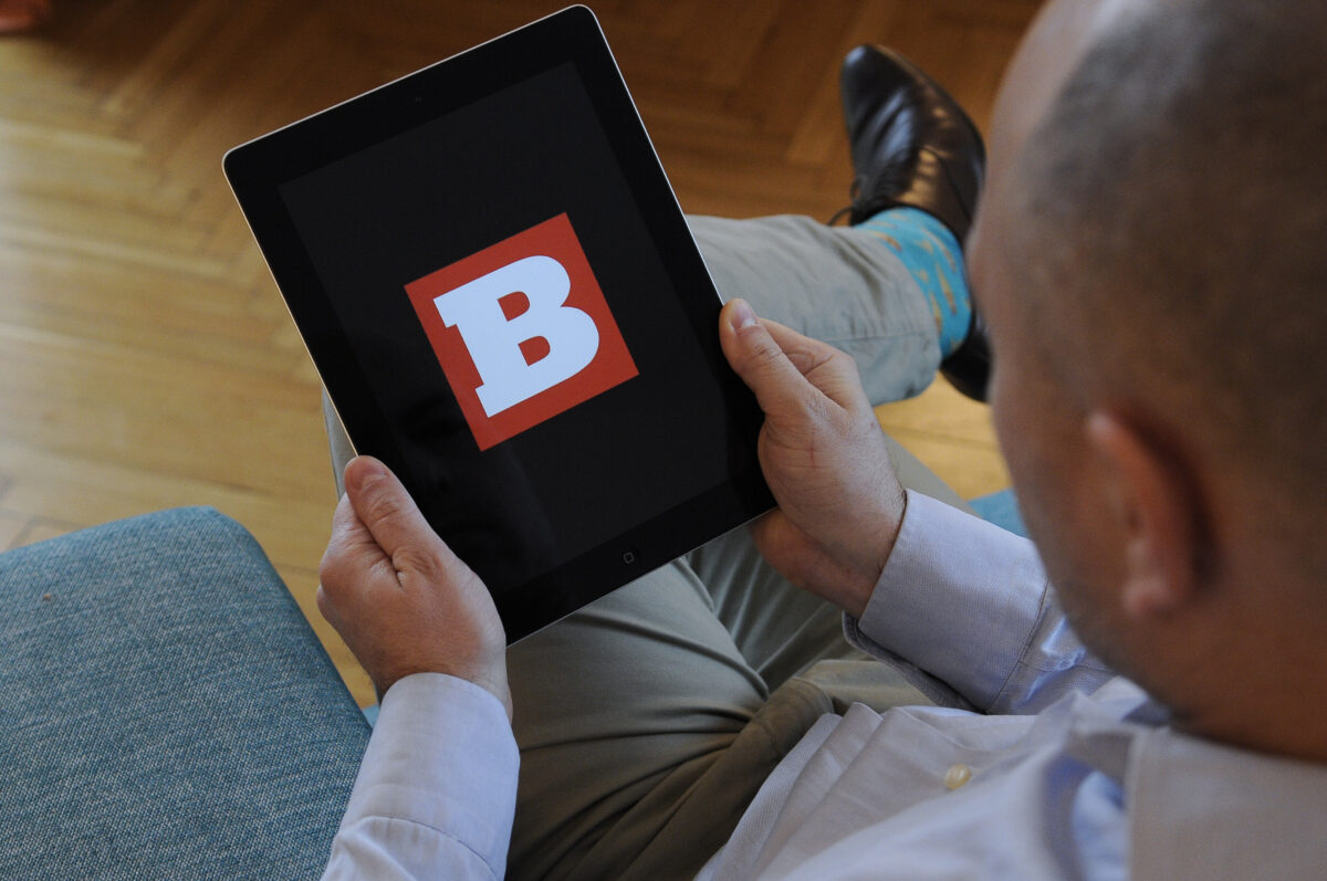 A man holds an iPad with the Breitbart logo on it's screen on November 10, 2017. (Photo by Jaap Arriens/NurPhoto via Getty Images)
