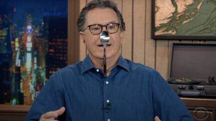 stephen colbert with a spoon on nose