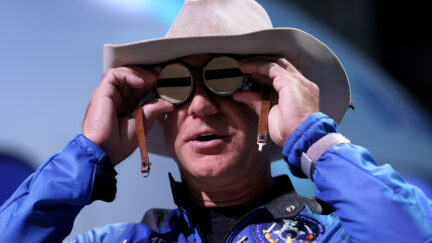 Jeff Bezos wearing cowboy hat and goggles