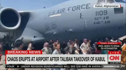 Afghans running alongside US Air Force plane