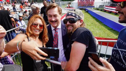 WELLINGTON, OHIO - JUNE 26: Supporters of former President Donald Trump take a selfie with My Pillow founder Mike Lindell as they wait for the start of a rally at the Lorain County Fairgrounds on June 26, 2021 in Wellington, Ohio. Trump is in Ohio to campaign for his former White House advisor Max Miller. Miller is challenging incumbent Rep. Anthony Gonzales in the 16th congressional district GOP primary. This is Trump's first rally since leaving office.