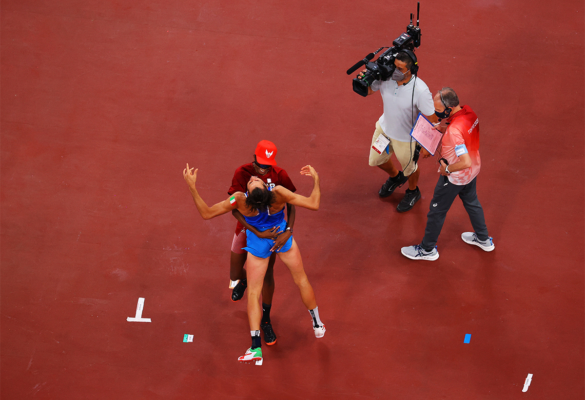 Gianmarco Tamberi of Team Italy and Mutaz Essa Barshim of Team Qatar react after winning the gold medal in the mens High Jump on day nine of the Tokyo 2020 Olympic Games at Olympic Stadium on August 01 2021 in Tokyo Japan