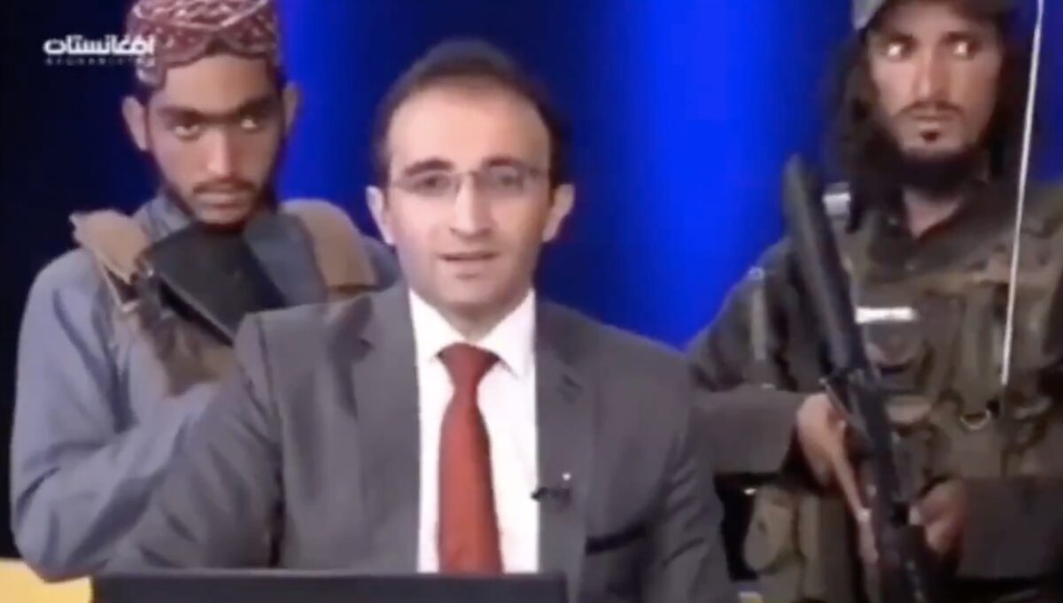armed Taliban behind Afghan news anchor