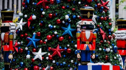 NEW YORK, NY - NOVEMBER 27: Nutcracker wearing protective masks are placed in front of a Christmas Tree at News Corporation on November 27, 2020 in New York, United States. Shoppers go out early despite ongoing concerns and limitations due to COVID-19 this year.