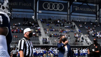 US Vice President Kamala Harris participates in the coin toss at the opening of the football game between Howard University and Hampton University at Audi Field in Washington, DC, on September 18, 2021. (Photo by Olivier DOULIERY / AFP) (Photo by OLIVIER DOULIERY/AFP via Getty Images)