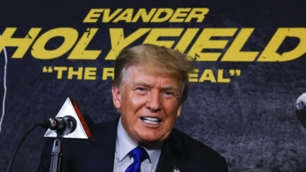 Trump poses before the Evander Holyfield fight, which was a box office fail