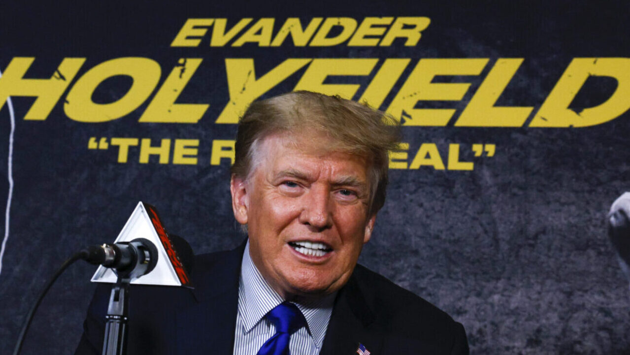 Trump poses before the Evander Holyfield fight, which was a box office fail