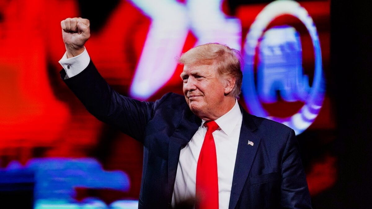 Former US President Donald Trump pumps his fist as he walks off after speaking at the Conservative Political Action Conference (CPAC) in Dallas, Texas