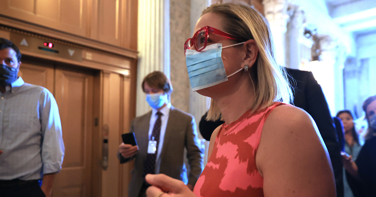 Sen. Kyrsten Sinema (D-AZ) arrives for votes in the Senate Chamber at the U.S. Capitol on September 30, 2021