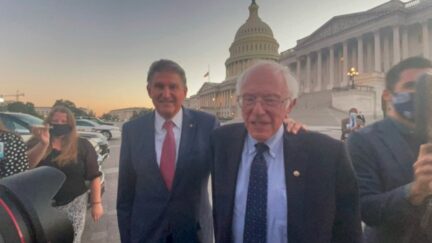 Joe Manchin and Bernie Sanders outside the Capitol
