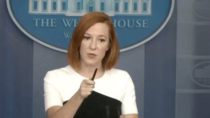 jen psaki wielding her pen like a magic wand to ward off the WH press corps