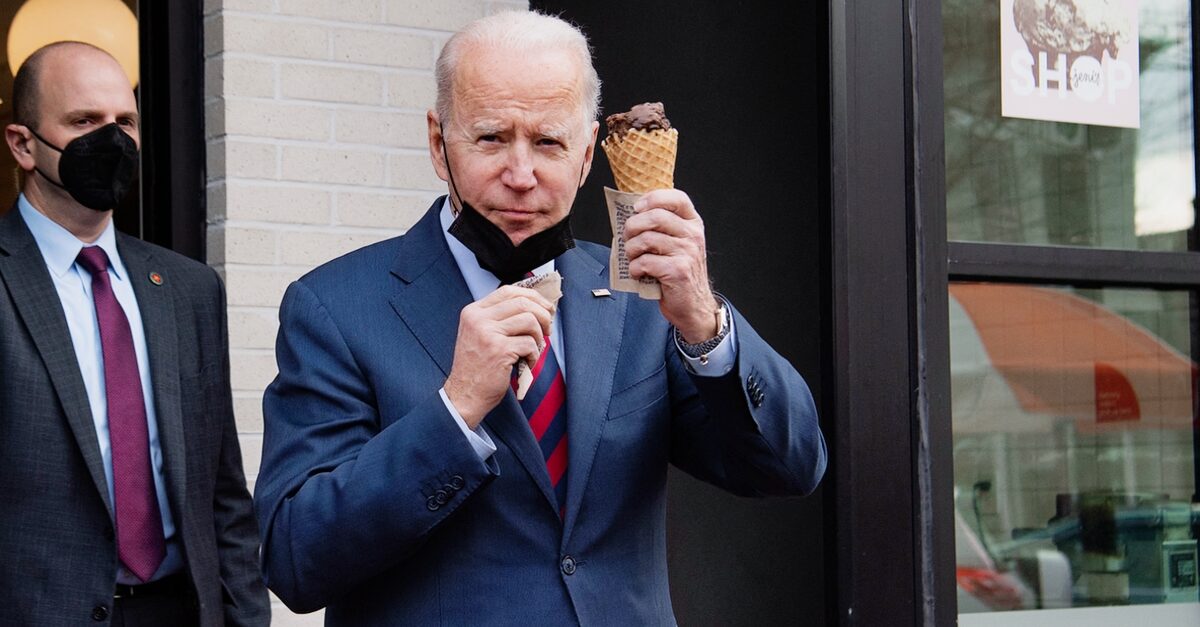US President Joe Biden carries an ice cream cone as he leaves Jeni's Ice Cream in Washington, DC, on January 25, 2022. (Photo by SAUL LOEB / AFP) (Photo by SAUL LOEB/AFP via Getty Images)