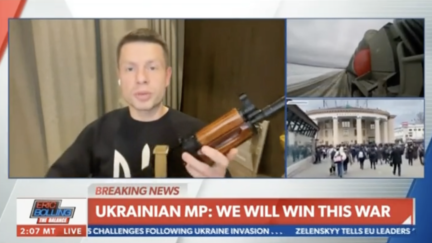 Ukrainian MP Clutches AK-47 During Interview, Vows to Fight