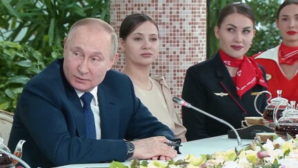 Putin Meets With Flight Attendants and Threatens Against No-Fly Zone