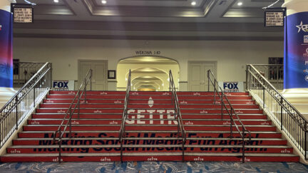 GETTR logo on stairs at CPAC 2022