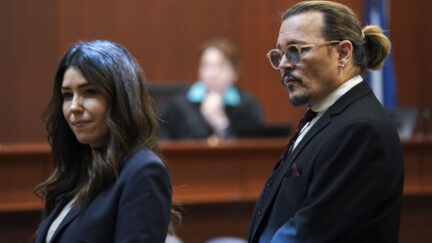 US actor Johnny Depp stands next to his lawyer Camille Vasquez