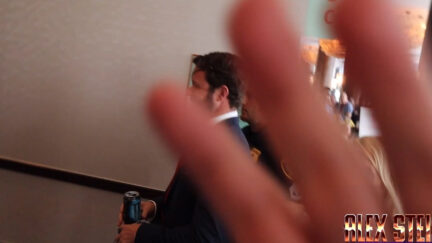 Member of Dan Crenshaw team puts hand over Alex Stein camera at TX GOP convention.