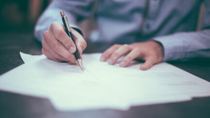 Person writing.