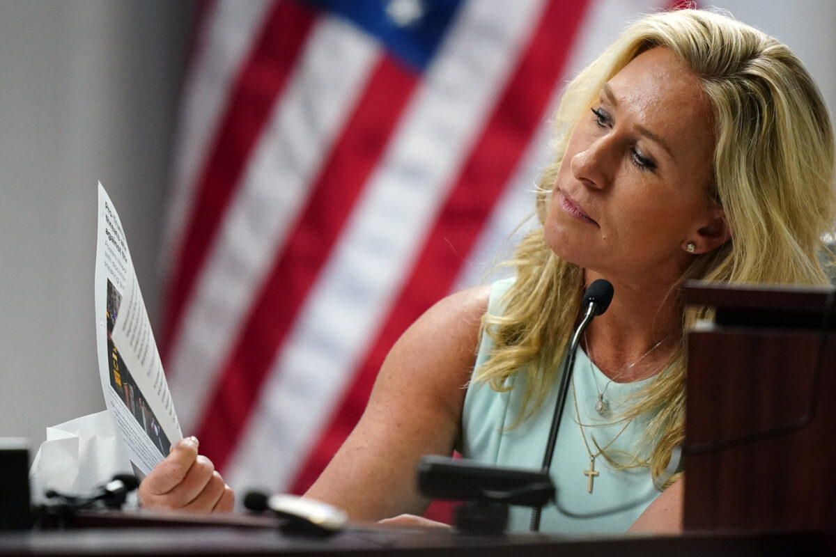 Marjorie Taylor Greene pretending to read