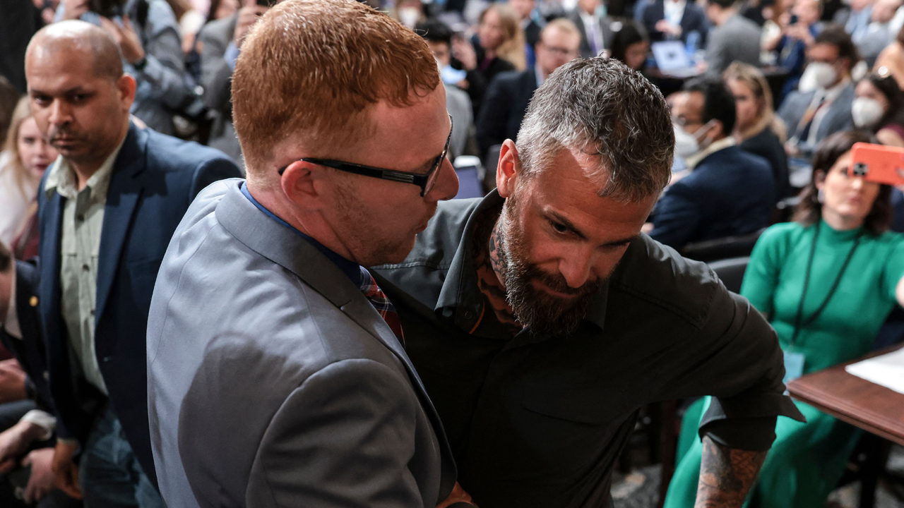 Stephen Ayres, who has pleaded guilty to entering the Capitol illegally on January 6, talks to former Washington Metropolitan Police Officer Michael Fanone at the conclusion of Thursday July 12 Hearing before the January 6 Committee.