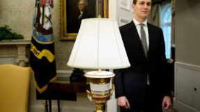 Jared Kushner fading into the background behind a table lamp
