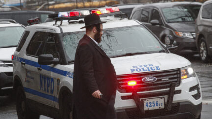 Jewish man near NYPD vehicle