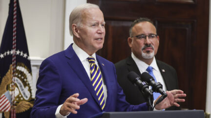 Joe Biden and Miguel Cardona