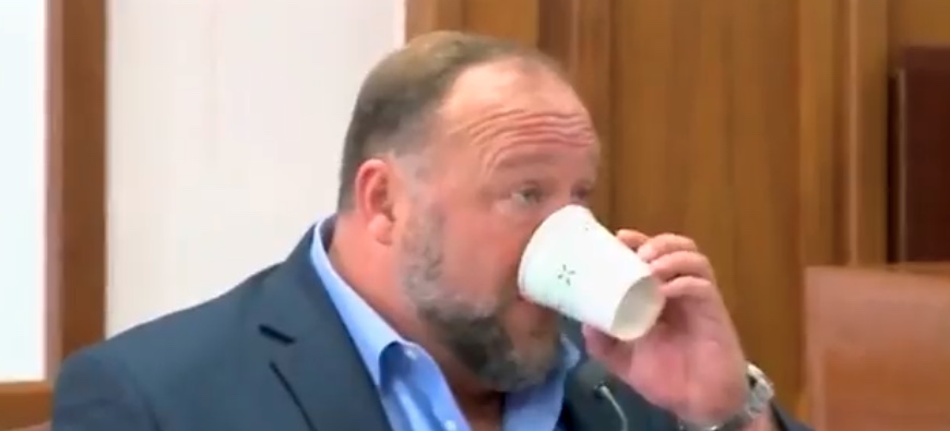 Alex Jones Takes ‘Sip’ from Empty Cup While on the Witness Stand for Some Reason