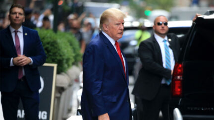 Former US President Donald Trump walks to a vehicle outside of Trump Tower in New York City on August 10, 2022