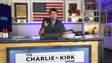 Charlie Kirk defends British colonialism in front of American flag