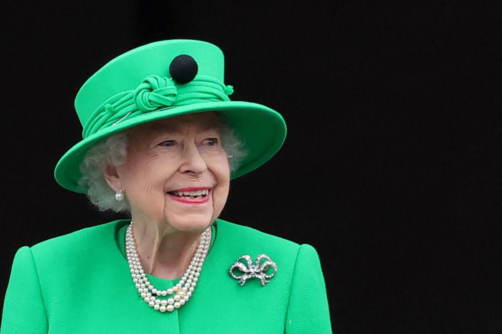 Queen Elizabeth II in her trademark matching hat and dress