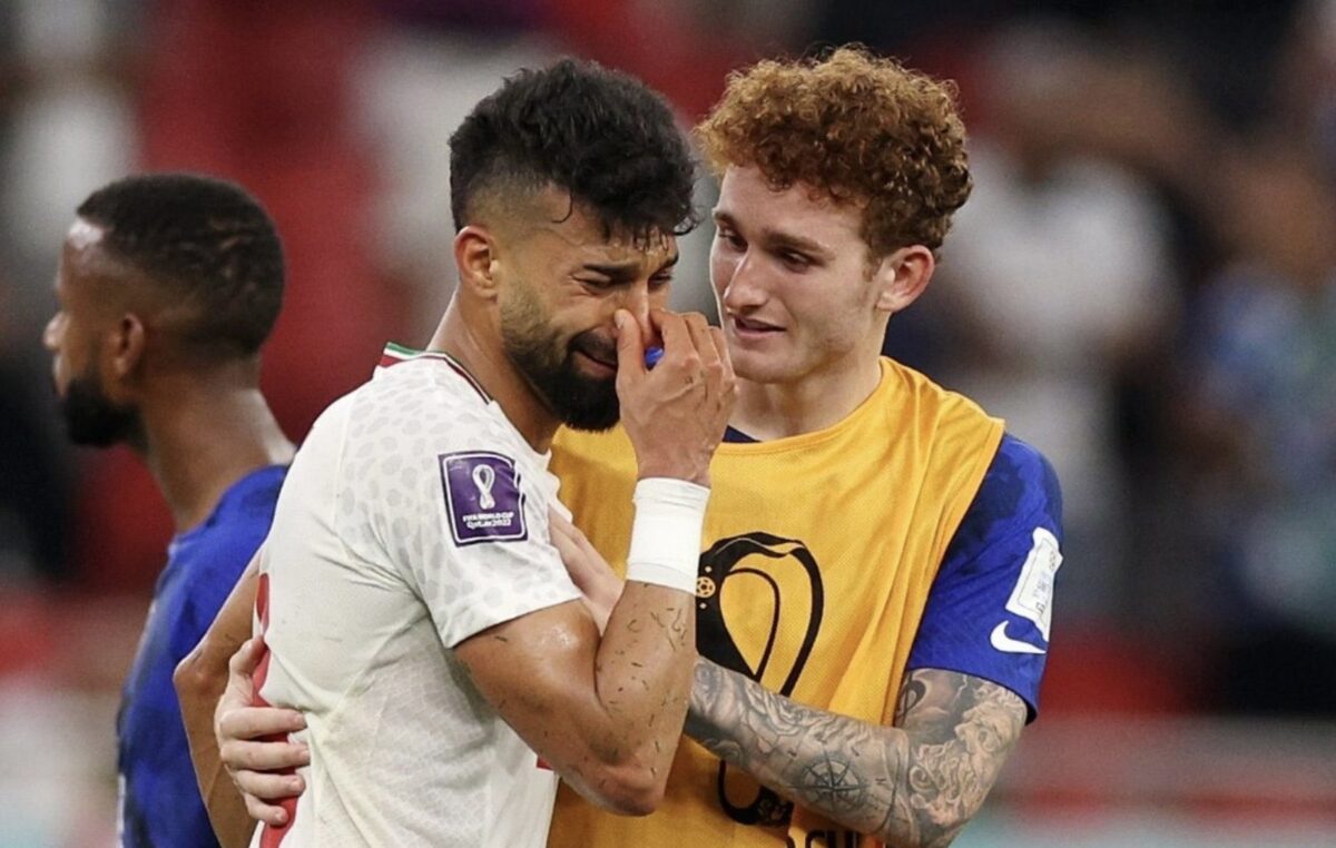 USA soccer players comfort Iranian players after game
