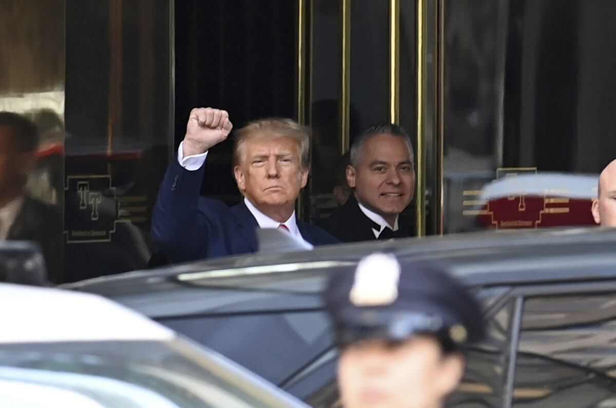 trump raising fist outside NYC courtroom
