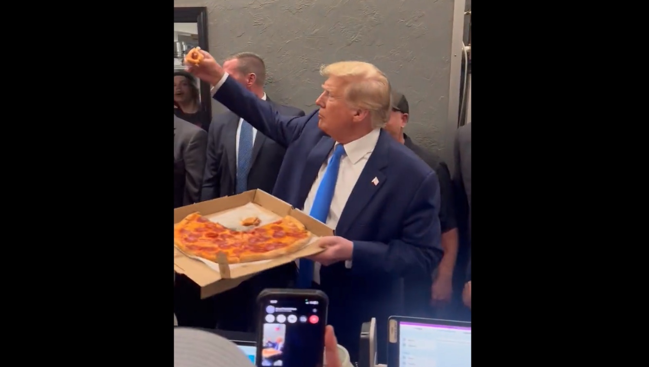 Trump eating pizza