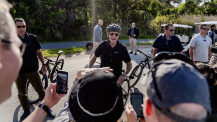 President Joe Biden speaks to members of the media as he goes on a bike ride in Gordons Pond State Park in Rehoboth Beach, Del., Sunday, May 14, 2023.
