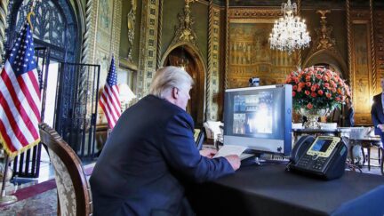 President Donald Trump speaks with members of the armed forces via video conference at his private club, Mar-a-Lago, on Thanksgiving, Thursday, Nov. 23, 2017, in Palm Beach, Fla.