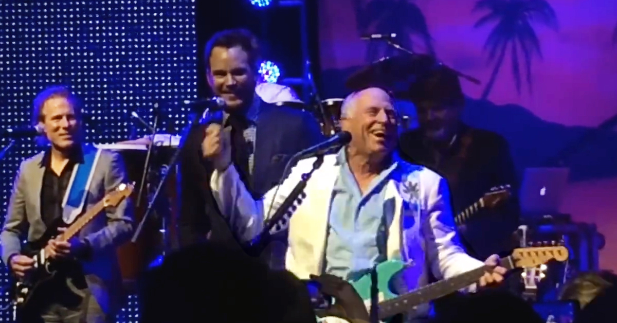 Jimmy Buffett’s ‘Perfect’ Jurassic World Cameo Is Going Viral, But He Also Sang Margaritaville With Star Chris Pratt at Premiere – VIDEO
