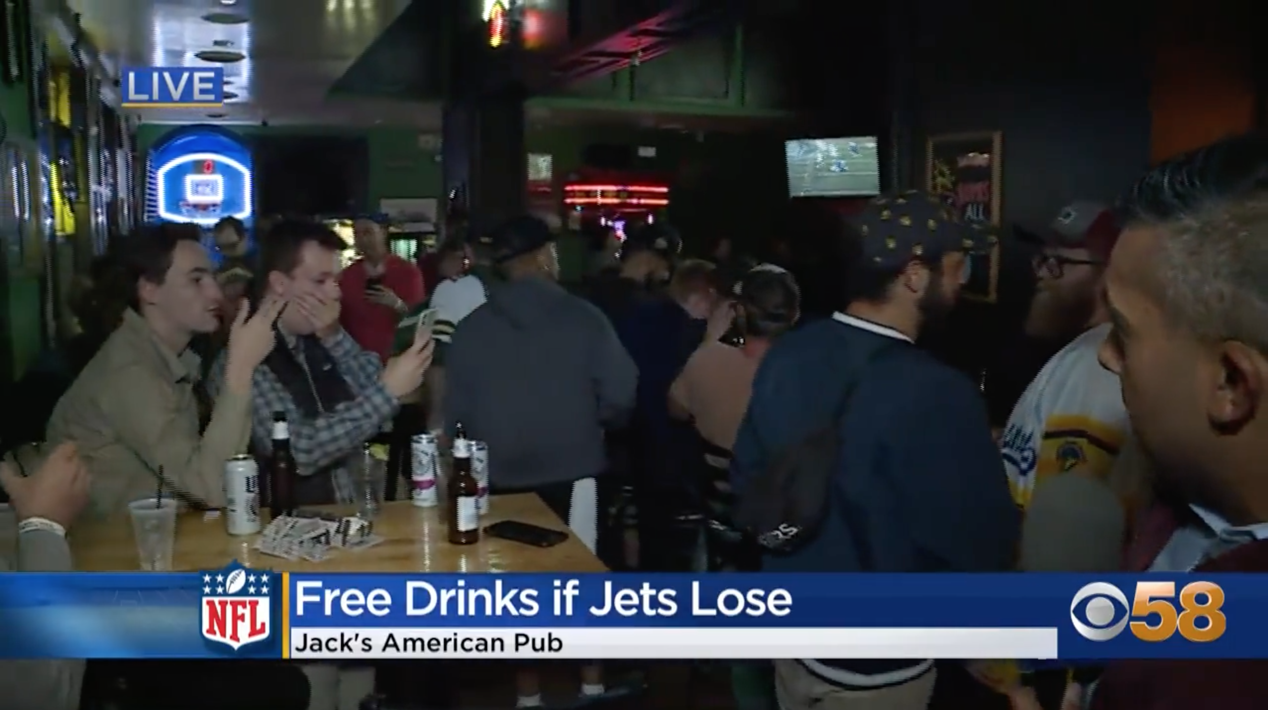 Patrons of Jack's American Pub react to losing a bet on the New York Jets