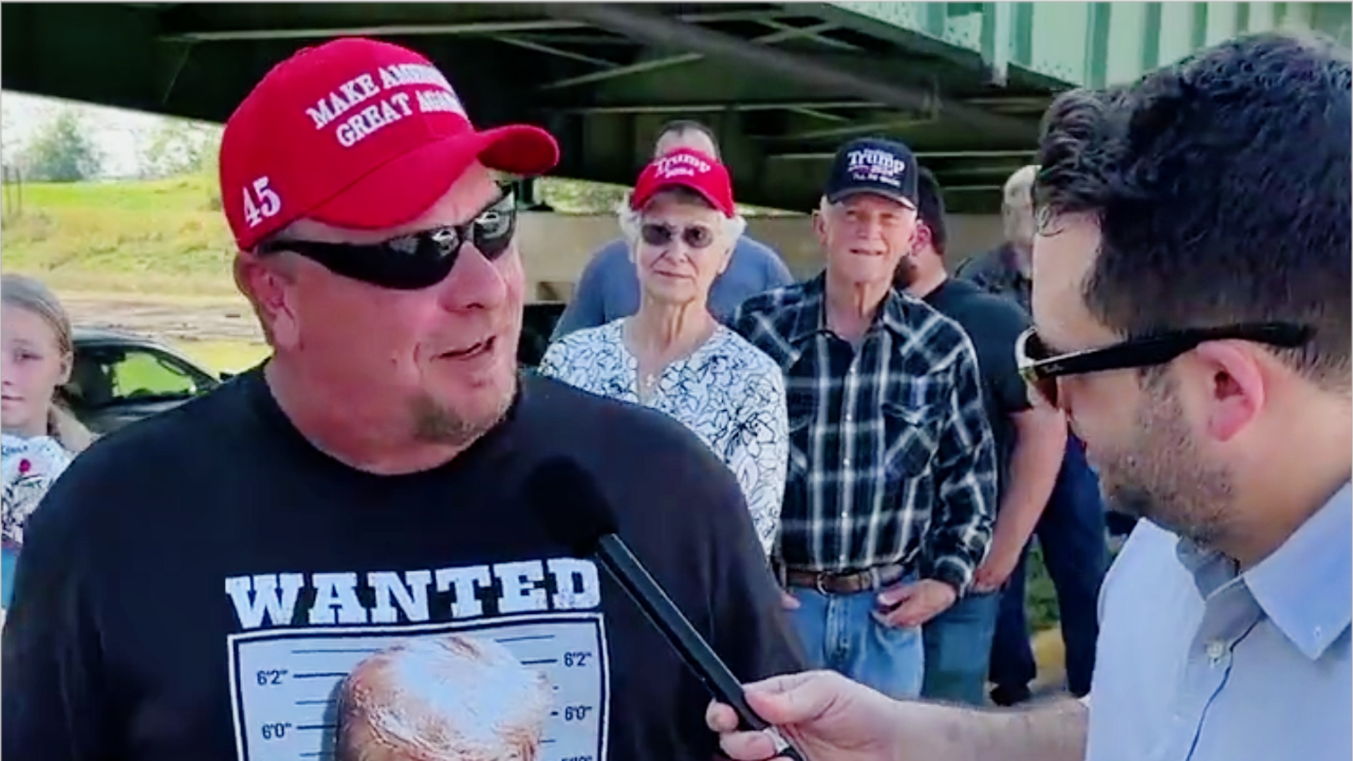 ‘That’s Literally a Picture of Him Surrendering!’ Trump Fan Confronted Outside Rally Over His ‘Never Surrender’ T-Shirt