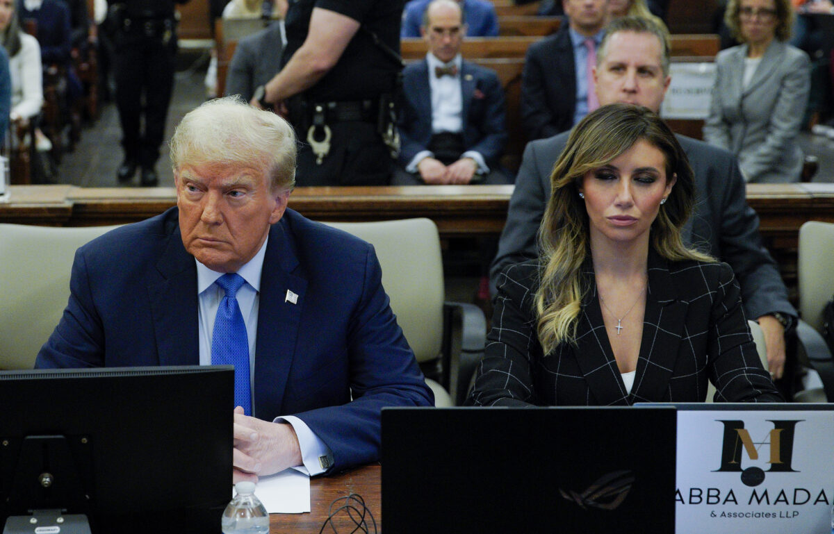 Donald Trump sitting next to attorney Alina Habba in courtroom