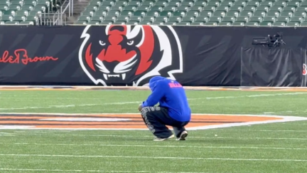 Buffalo Bills safety Damar Hamlin kneels at midfield after the Sunday Night Football game between the Bills and the Bengals