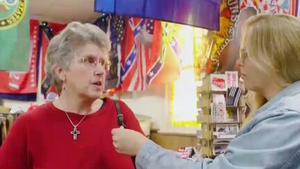 Woman In Trump Store Rips Opponents' Lack of Kindness — Literally While Standing In Front of Confederate Flags