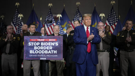 Donald Trump debuts 'bloodbath' signage at rally.