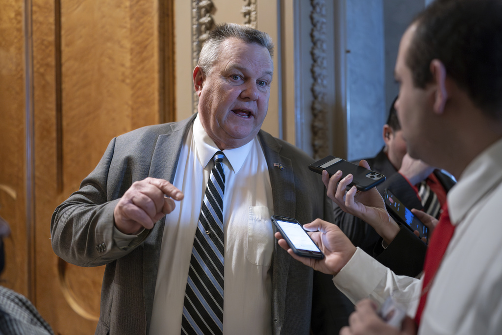 Sen. Jon Tester, D-Mont., speaks with reporters about the border security talks, outside the chamber at the Capitol in Washington, Thursday, Jan. 25, 2024. Any bipartisan border deal could be doomed because of resistance from former President Donald Trump.