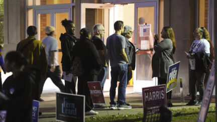 Voters wait in line to cast their ballots at the Kingston Armory in Wilkes-Barre, Pa, Tuesday, Nov. 5, 2024.