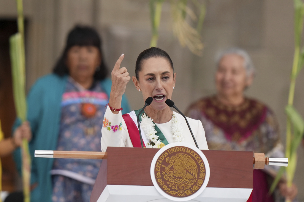 FILE - Newly-sworn in President Claudia Sheinbaum addresses supporters in the Zócalo, Mexico City's main square, on Oct. 1, 2024.